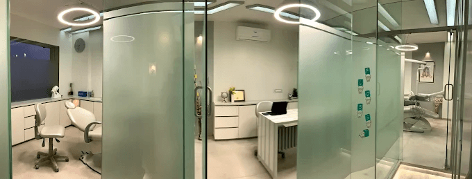 Clinic overview — glass-walled treatment rooms